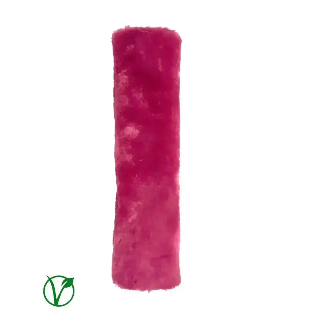 A vibrant magenta rhinegold luxe noseband cover with soft fuzzy fur pile for a noseband cover luxury look