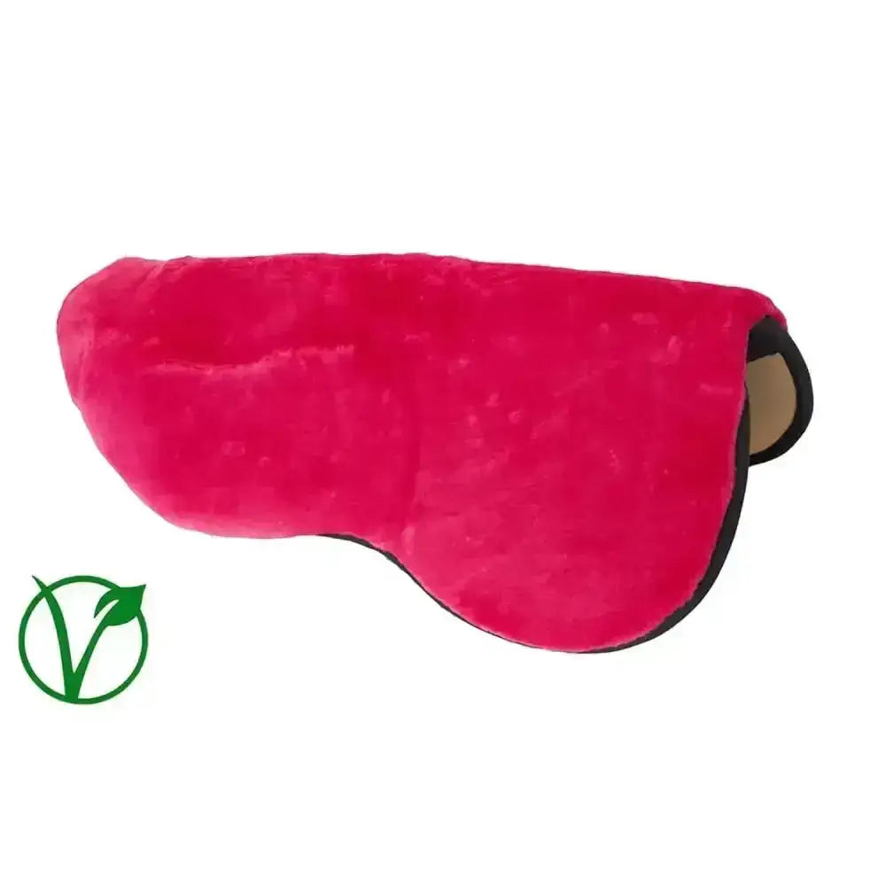 A plush vibrant pink rhinegold luxury seat saver with soft velvety texture and black trim fur pile seat saver