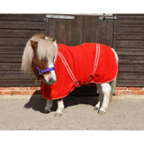 A vibrant red rhinegold mini fleece rug with white trim and adjustable straps for small ponies comfortable cosy fleece