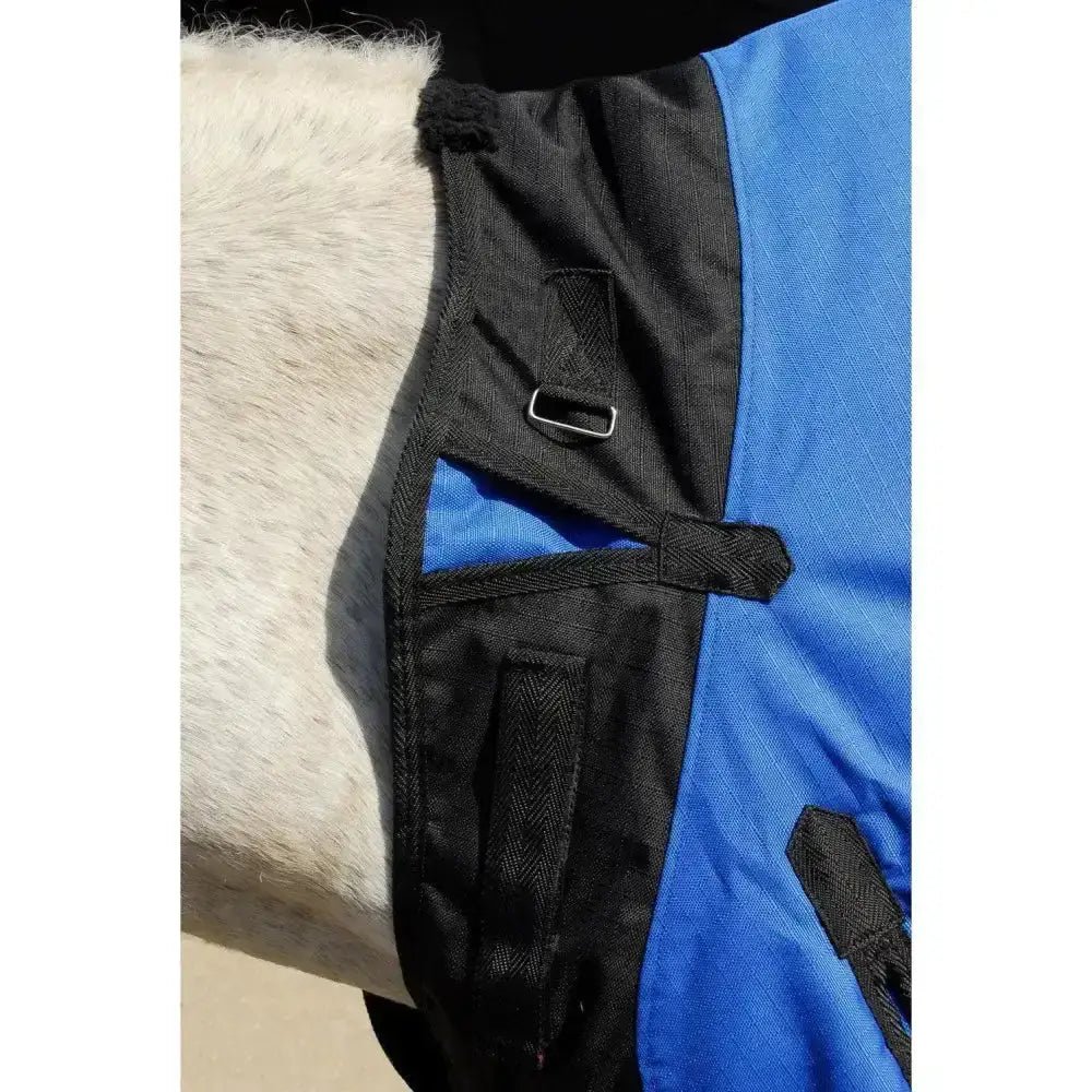 Blue and black rhinegold phoenix outdoor horse blanket with textured weave and easily adjustable neckline straps and metal buckles