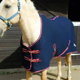 Navy blue quilted rhinegold premium tech cooler rug with pink trim and red buckle closures celltex cooler rug