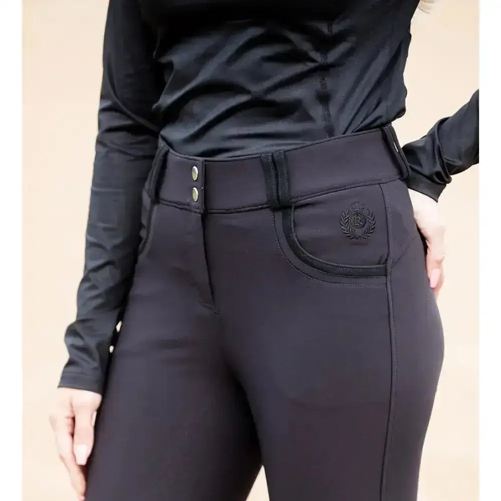 Black rhinegold pro stretch riding pants with sleek fit and subtle embroidered logo on front pocket hybrid style breeches