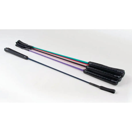 Set of four colorful rhinegold riding crop whips with black textured handles and rubberized grips for riding use