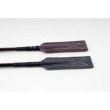 Two leather rhinegold show jumping crops in dark brown and black with white stitching and golf grip handle