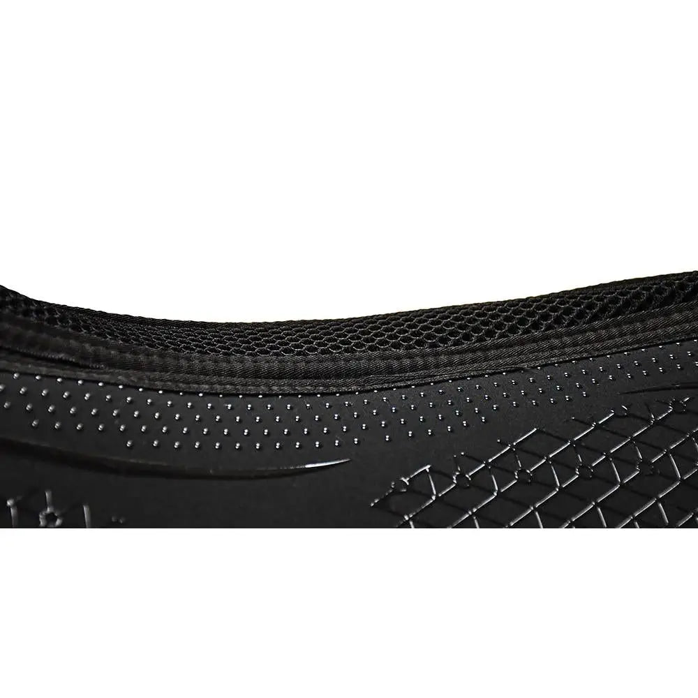 Black Nike Air Max 90 sneaker with mesh upper and textured rubber sole shown alongside Rhinegold silicone memory foam saddle pad
