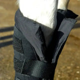 Black rhinegold stable medicine boots with detachable cotton padded liner and neoprene outer featuring velcro straps