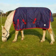 Navy blue rhinegold torrent spot turnout rug with red trim and buckles lightweight spot horse rug