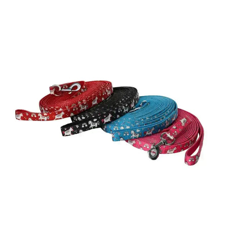 Four colorful rhinegold unicorn lunge reins made of strong webbing with white unicorn patterns and metal hardware