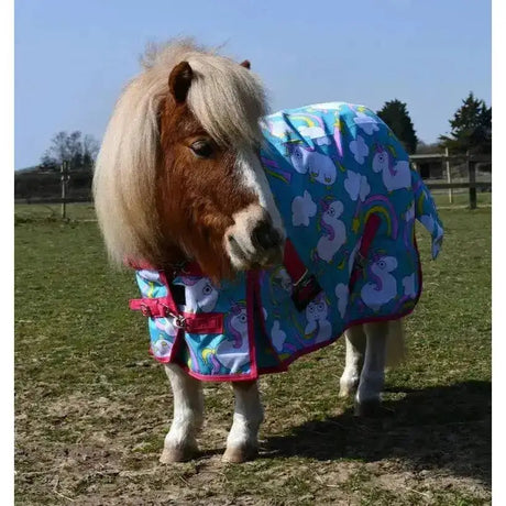 Vibrant blue rhinegold unicorn mini horse blanket with pink trim and rainbow unicorn mini torrent outdoor rug pattern