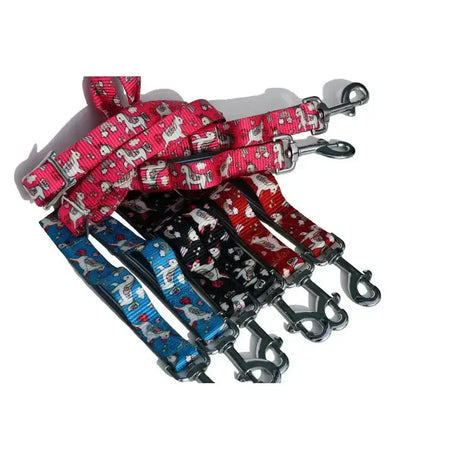 A set of colorful rhinegold unicorn pony side reins with trigger clip ends on woven fabric and metal buckles