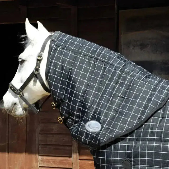 Black quilted rhinegold vegas neck cover with white grid pattern and silver buckles matching vegas rug
