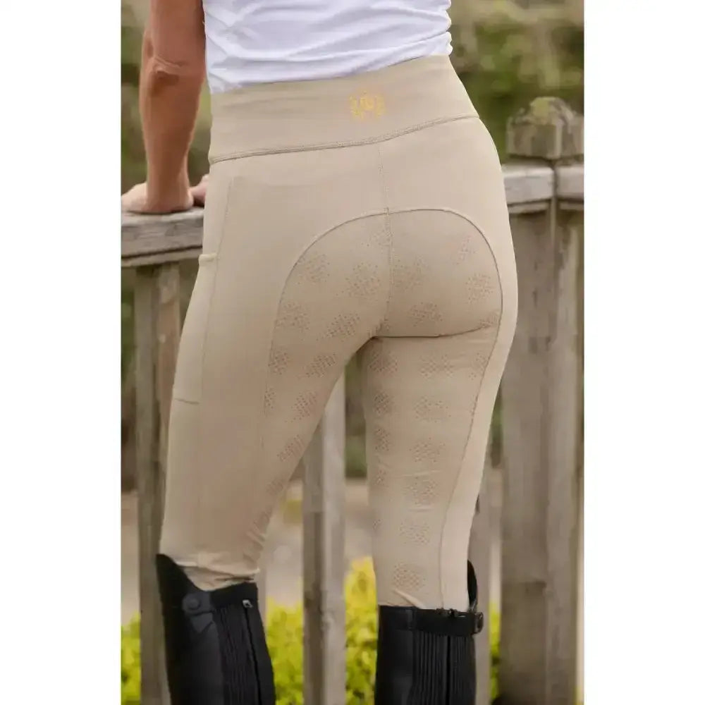 Beige rhinegold vogue full seat performance tights with subtle textured panels and small gold logo on waistband