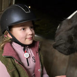 Black equestrian helmet with subtle silver trim and small logo designed for rider emergency tag enduro safety use