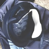Black riding hat ear warmers with white padded interior and mesh ventilation panel for riding comfort