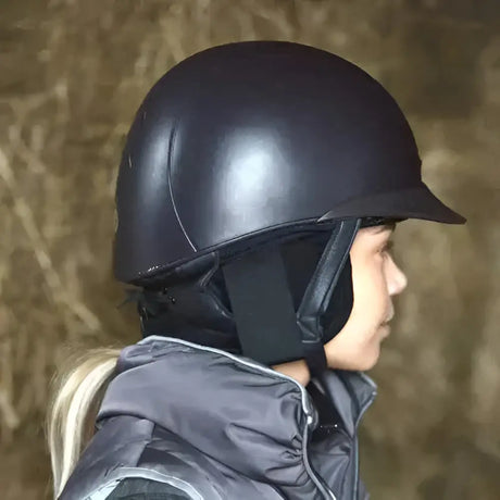 Black glossy riding hat ear with padded interior and adjustable straps for hat ear warmers and ear muffs use