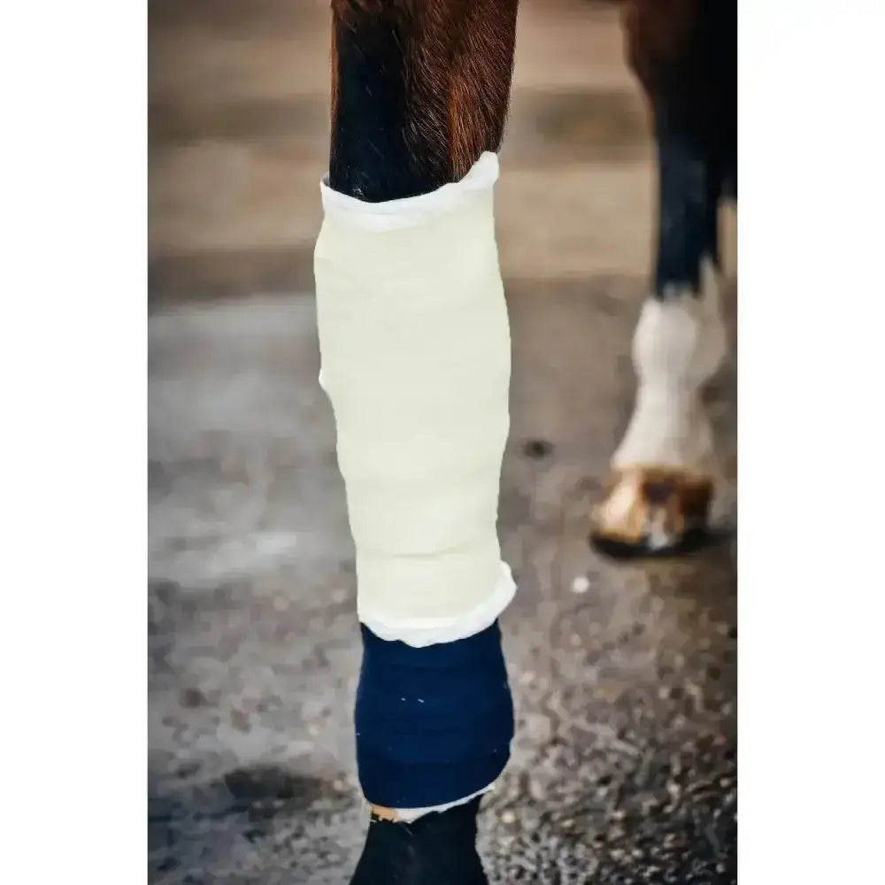 Cream-colored soft textured equiwrap bandage with navy blue band by Robinsons Healthcare vet wrap Robinsons