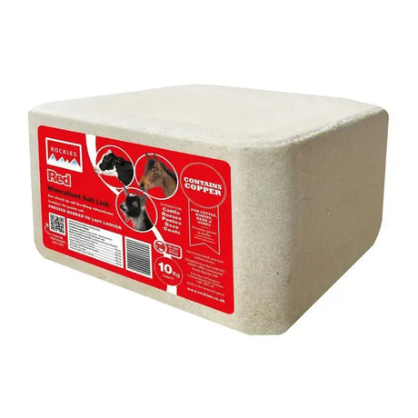 A beige rectangular block of mineralised salt lick with a red label for cattle horses and goats rockies red salt