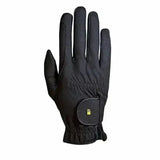 Black roeckl chester grip summer riding glove with small green logo on wrist strap showing back side