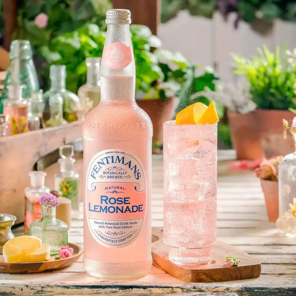 A tall clear glass bottle of fentimans rose lemonade with a pink label and silver cap for mixed antipasti selection