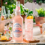 A tall clear glass bottle of fentimans rose lemonade with a pink label and silver cap for mixed antipasti selection