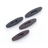 Black oval-shaped plastic rubber rein stops with central slot for running martingales and martingale rings sliding