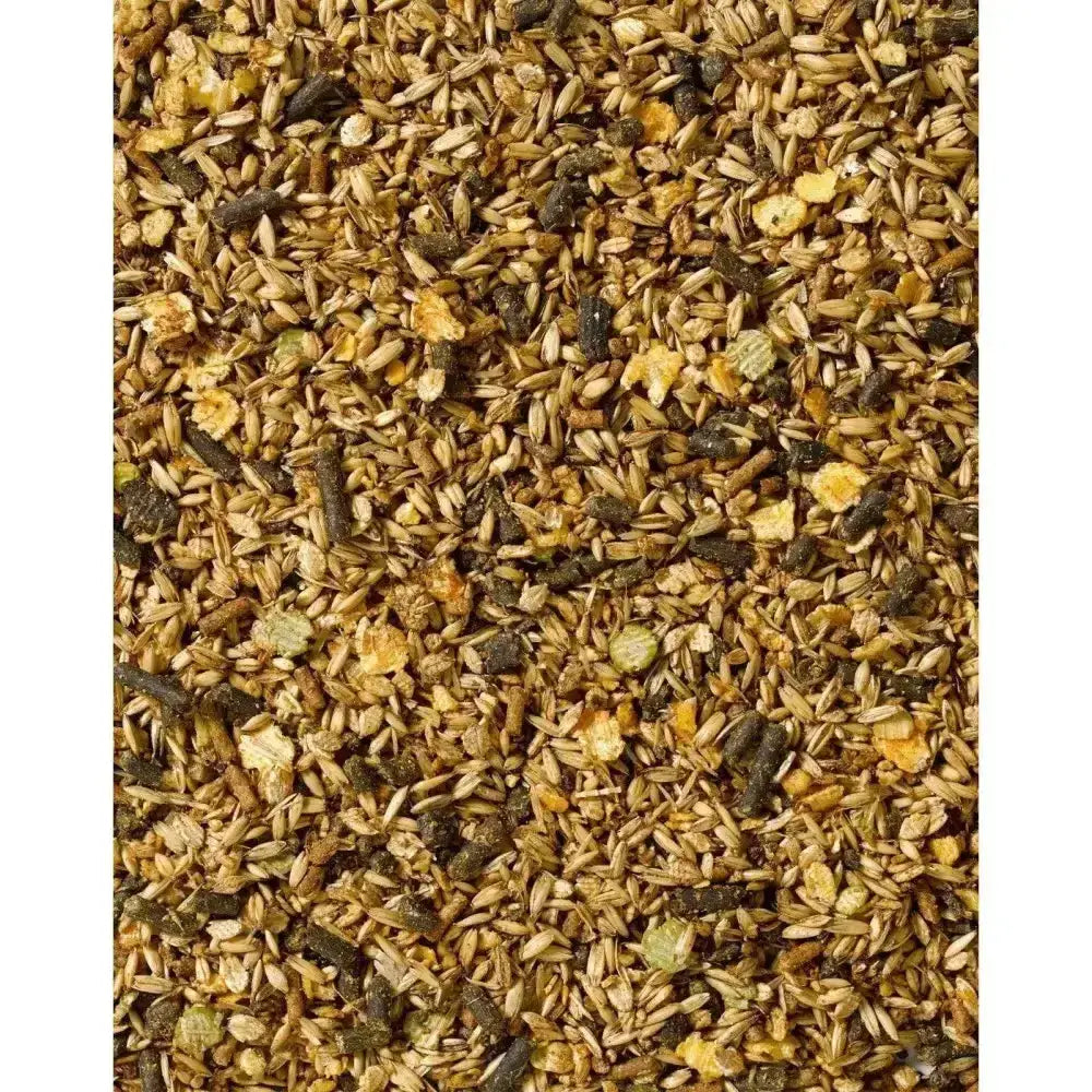 A mix of golden brown and dark brown grains and seeds in saracen competition fit performance horses fibre mix