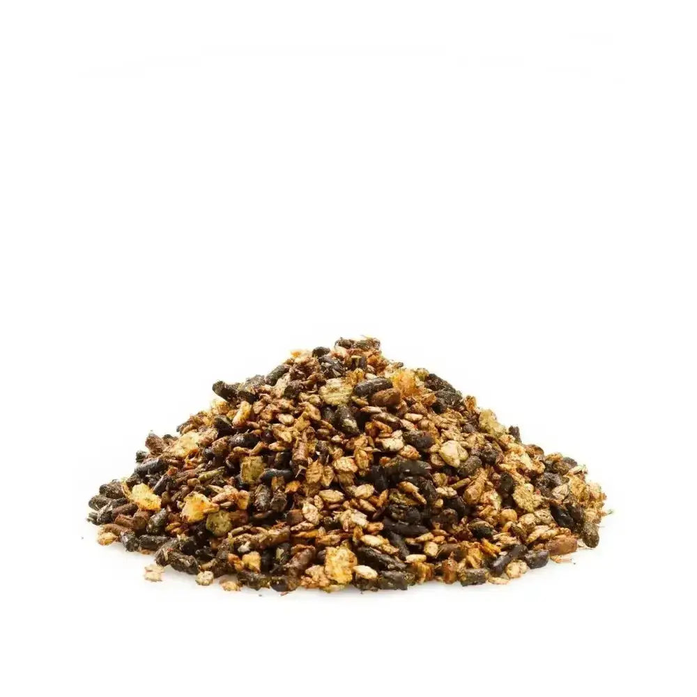 A mound of dark brown and golden granola clusters with oats seeds and dried fruit in saracen condition improver mix