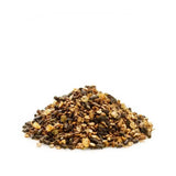 A mound of dark brown and golden granola clusters with oats seeds and dried fruit in saracen condition improver mix