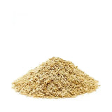 A mound of light brown saracen english bruised oats with a slightly rough texture perfect for cooking and baking