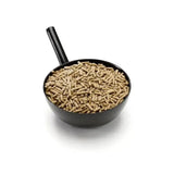 Black plastic scoop filled with brown wood pellet cereal-free feed from saracen re-coup cube for gastric ulceration