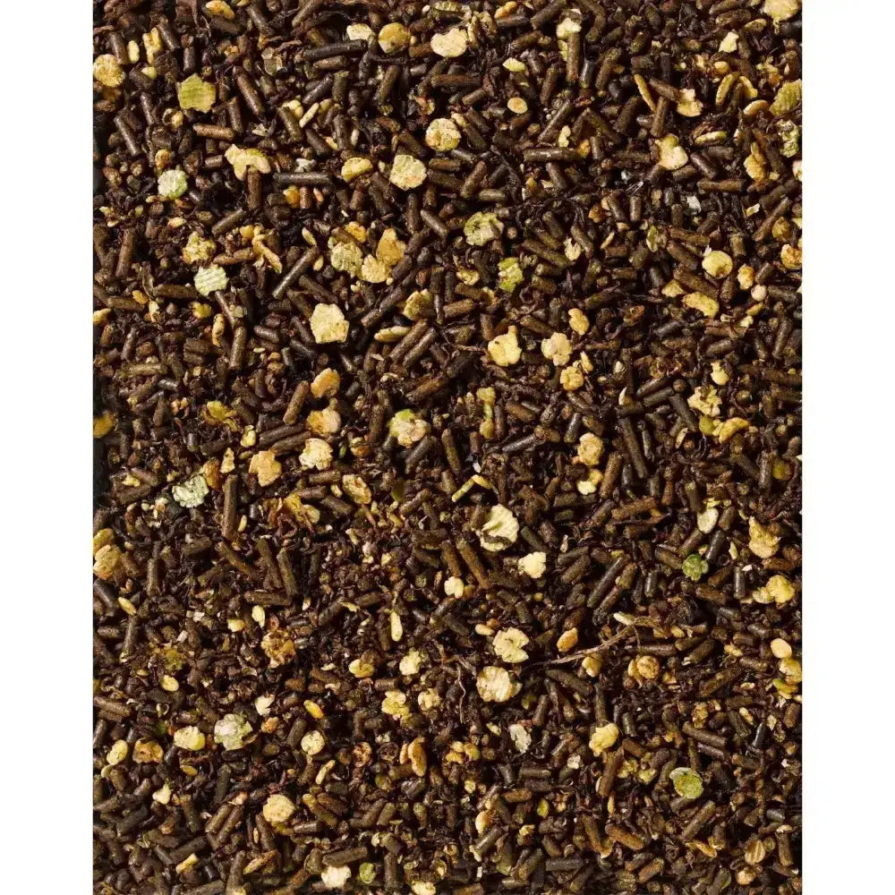 A mix of dark brown and light yellow pelletized saracen re-leve mix horse feed for performance horses intolerant to cereal based diets