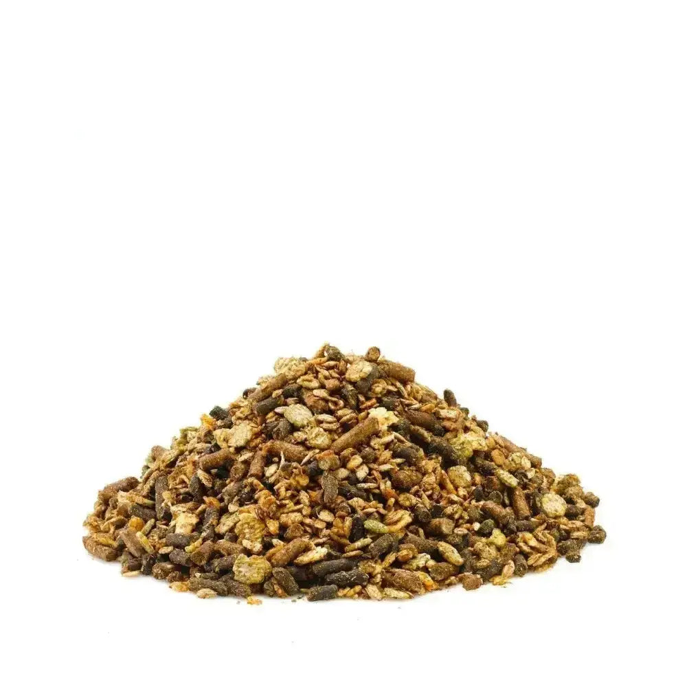 A mound of brown and green granular saracen veteran mix pet food with varied textures in a highly digestible mix designed specifically