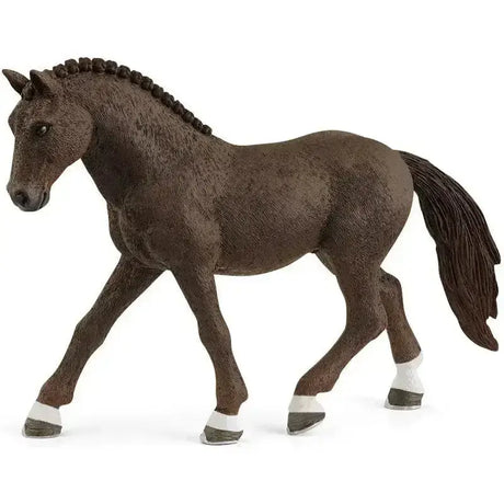 Detailed brown plastic schleich german riding pony gelding figurine with braided mane and white hoof wraps