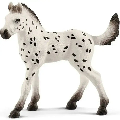 Schleich knapstrupper foal toy horse figurine with white and black spots and detailed mane tail and hooves
