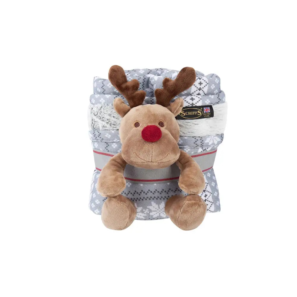 A plush brown squeaky reindeer toy with red nose sits on a gray and white snowflake scruffs santa paws blanket