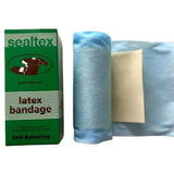 Light blue self adhering sealtex latex bandage roll next to green sealtex latex bit wrapping packaging
