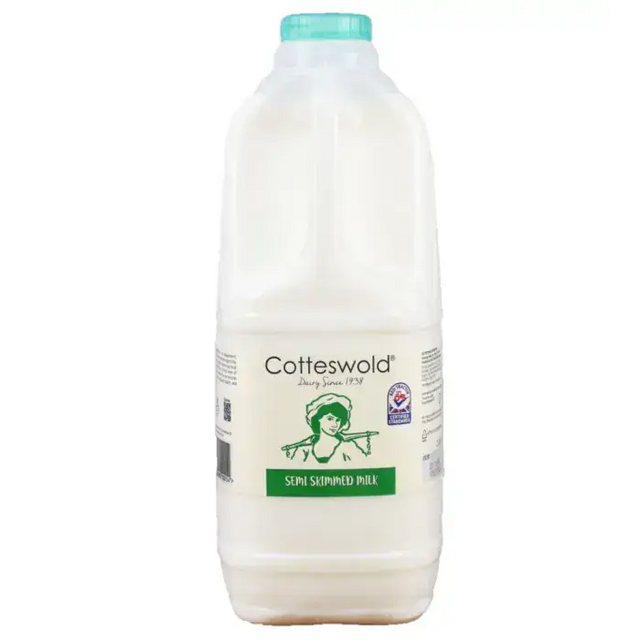 A white plastic bottle of cotteswold semi skimmed milk with a teal cap and green vintage label