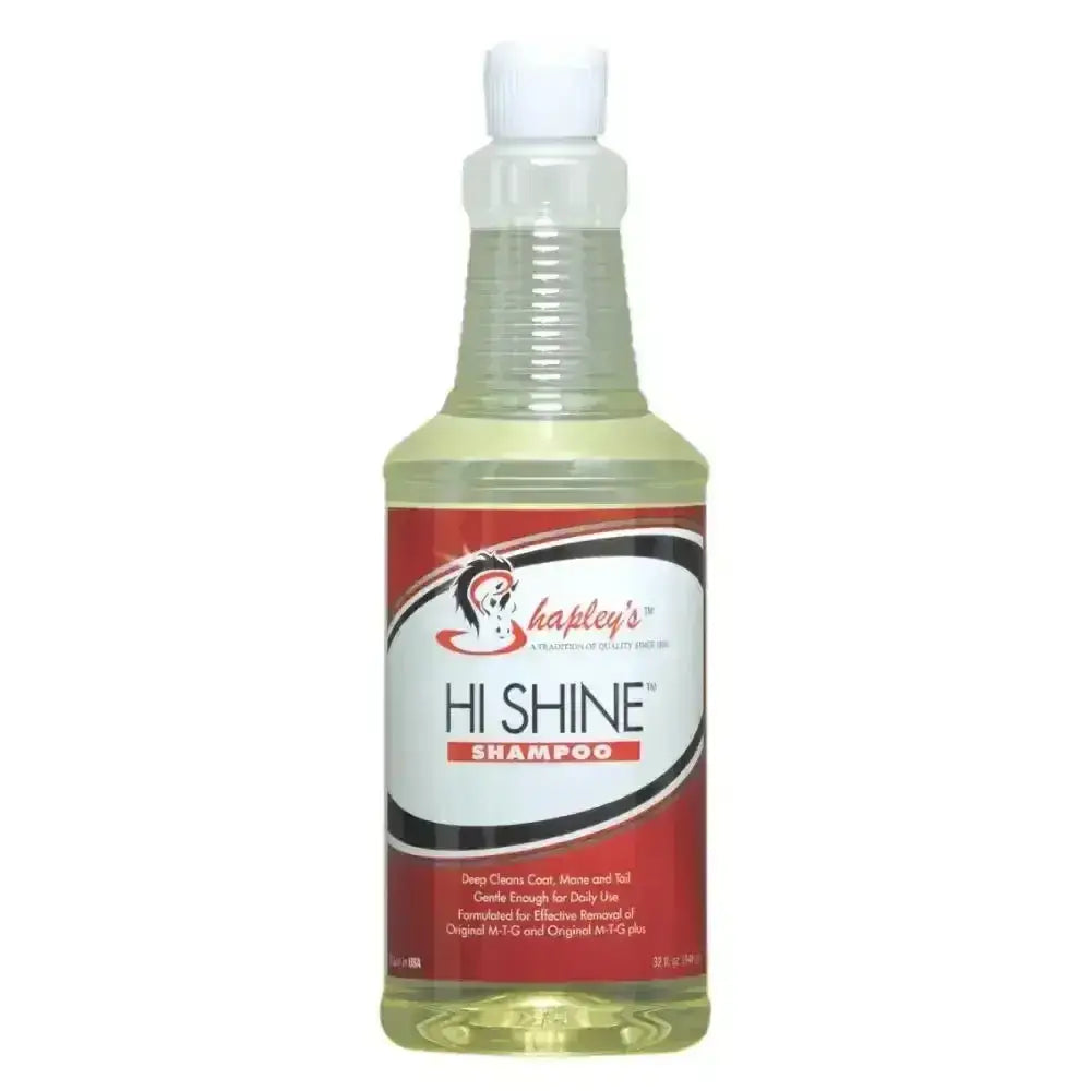 A clear plastic bottle with a white spray nozzle containing pale yellow shapleys high shine shampoo for gently deep cleans