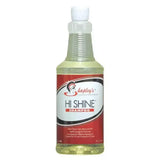 A clear plastic bottle with a white spray nozzle containing pale yellow shapleys high shine shampoo for gently deep cleans