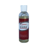 A clear plastic bottle with white cap of shapleys high shine red labeled shampoo gently deep cleans horse coats