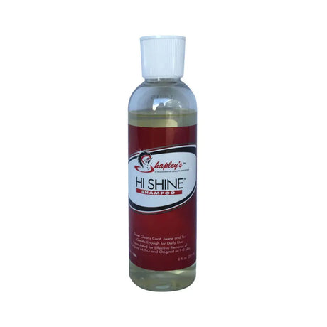 A clear plastic bottle with white cap of shapleys high shine red labeled shampoo gently deep cleans horse coats