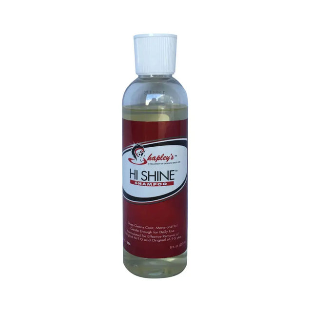 A clear plastic bottle with white cap of shapleys high shine red labeled shampoo gently deep cleans horse coats