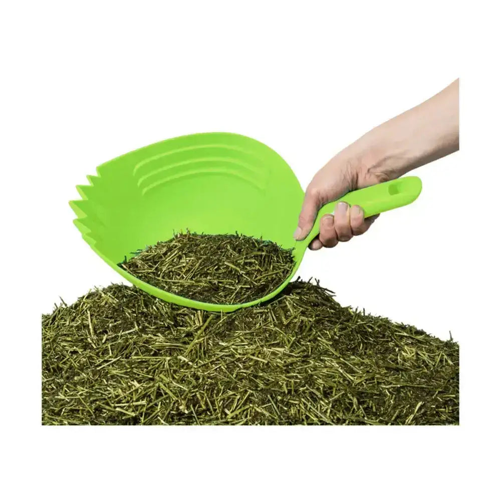 Bright green plastic shark skup dustpan with serrated edge and ergonomic handle designed feed scoop for loosening compacted feed