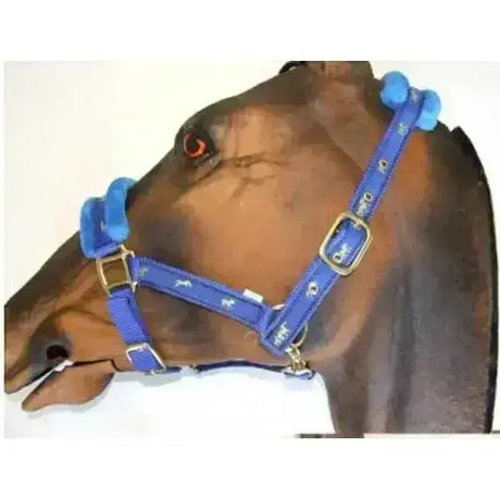 Blue sheldon fluffy nylon headcollar with white horse silhouettes and gold horse ribbon buckles with removable fleece