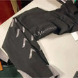 Black sheldon medway riding tights with silver reflective chevron stripes and silicone knee patch on the thigh