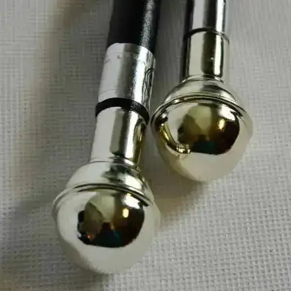 Two metallic showing cane chrome ball walking canes with black leather handles and silver leather covered shank joints