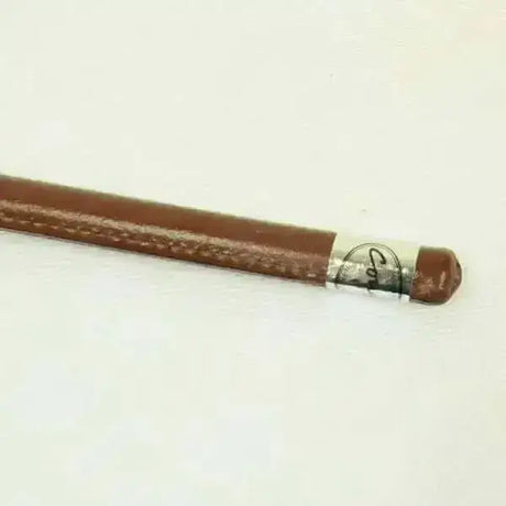 Brown leather showing cane with silver metal band and rounded tip for crops and whips collection