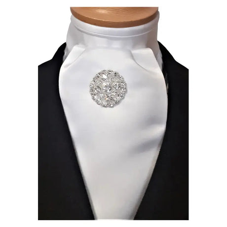 A sparkling silver rhinestone brooch on a crisp white showquest estelle stock ready-tied cravat