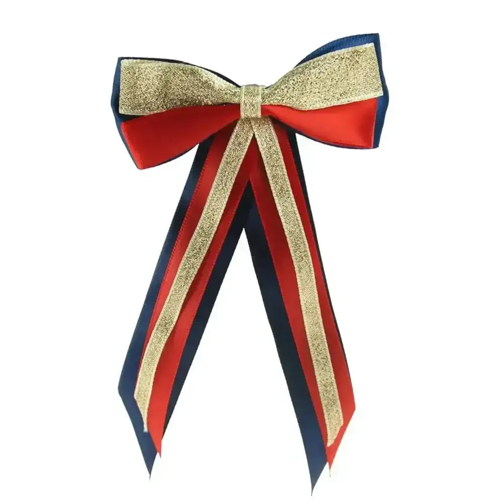 A festive red gold and navy blue glittery showquest hairbow perfect for a finishing showring touch