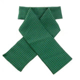 A dark green showquest pin spot ready-tied stock with small white polka dots crafted from smooth glossy fabric